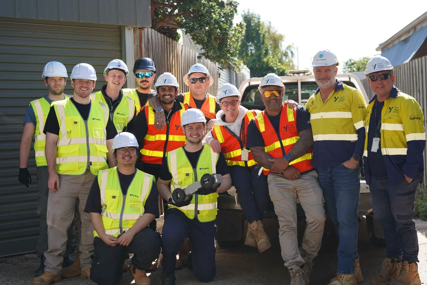 Puralink team and customer at a field deployment site with the Ferret robot